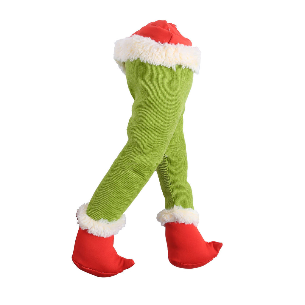 Green prosthetic leg Christmas ornament in festive setting