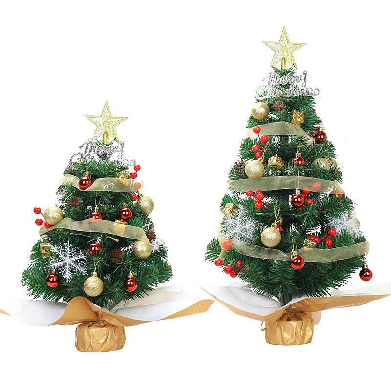 Assorted color desktop Christmas trees displaying green, pink, and white options