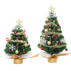 Assorted color desktop Christmas trees displaying green, pink, and white options