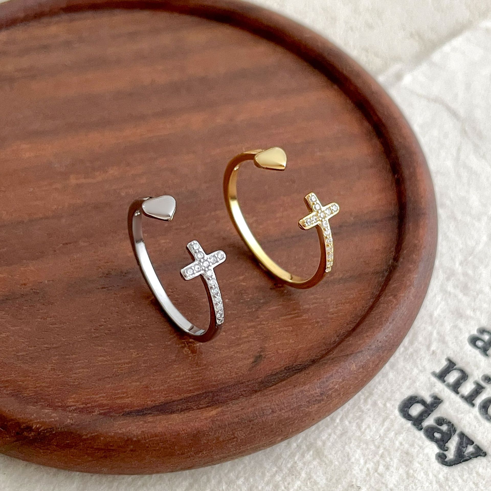 Gold-plated sterling silver ring with cross and heart design