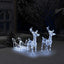 Illuminated reindeer and sleigh with warm white LEDs glowing against night sky