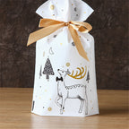 Green Christmas gift bag featuring forest creatures holiday theme