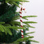 Red and white plastic Christmas tree crutches on display