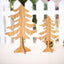 Wooden elk ornament with rustic charm hanging on a Christmas tree in warm lighting