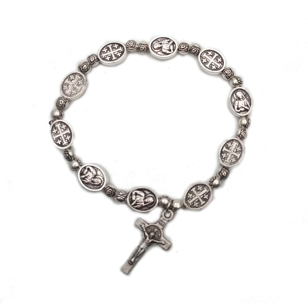 Adjustable rosary bracelet laid flat showing full strand of rose beads