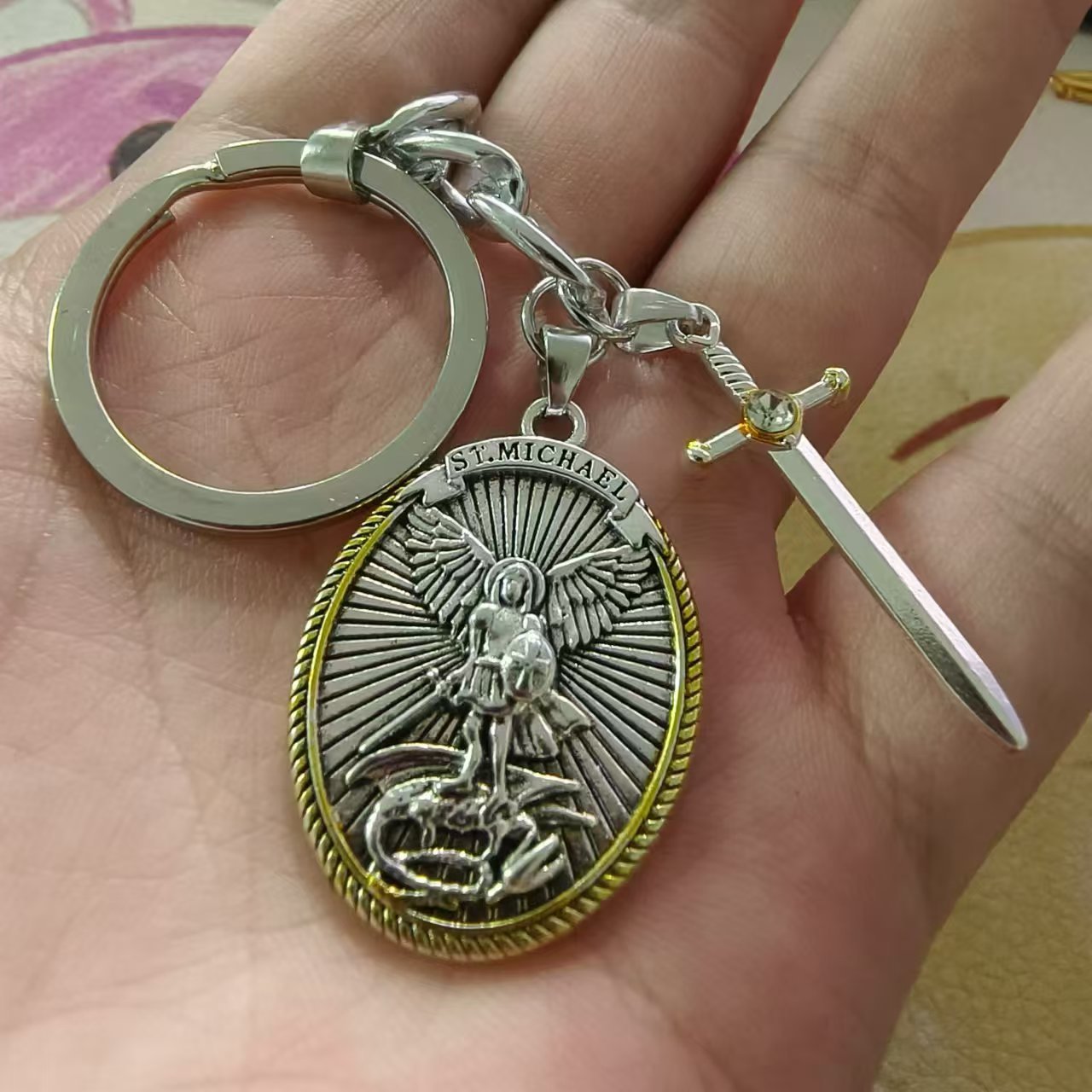 Close-up view of vintage shield pendant keychain with elegant crown design for faithful women