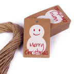 Assorted kraft paper Christmas tags featuring festive motifs for gifting