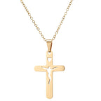 Close-up of stainless steel cross pendant detail showing vintage design