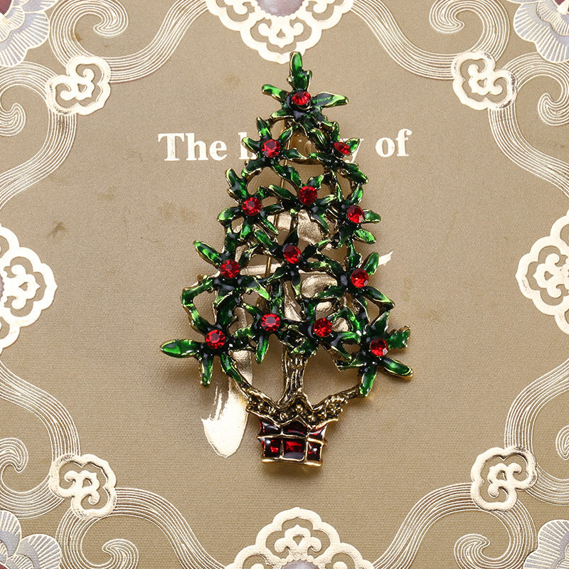 Close-up view of green alloy Christmas tree brooch pin