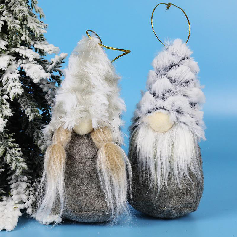 Plush Christmas figures arranged for festive window scene