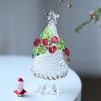 Handmade glass decoration featuring Christmas tree with red blooms