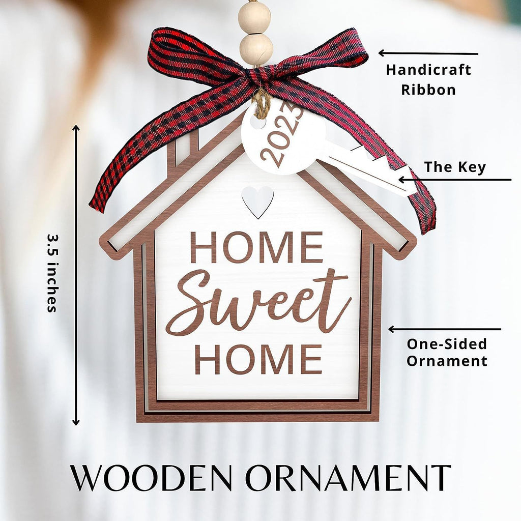 Cozy wooden house pendant ornament on decorated evergreen tree
