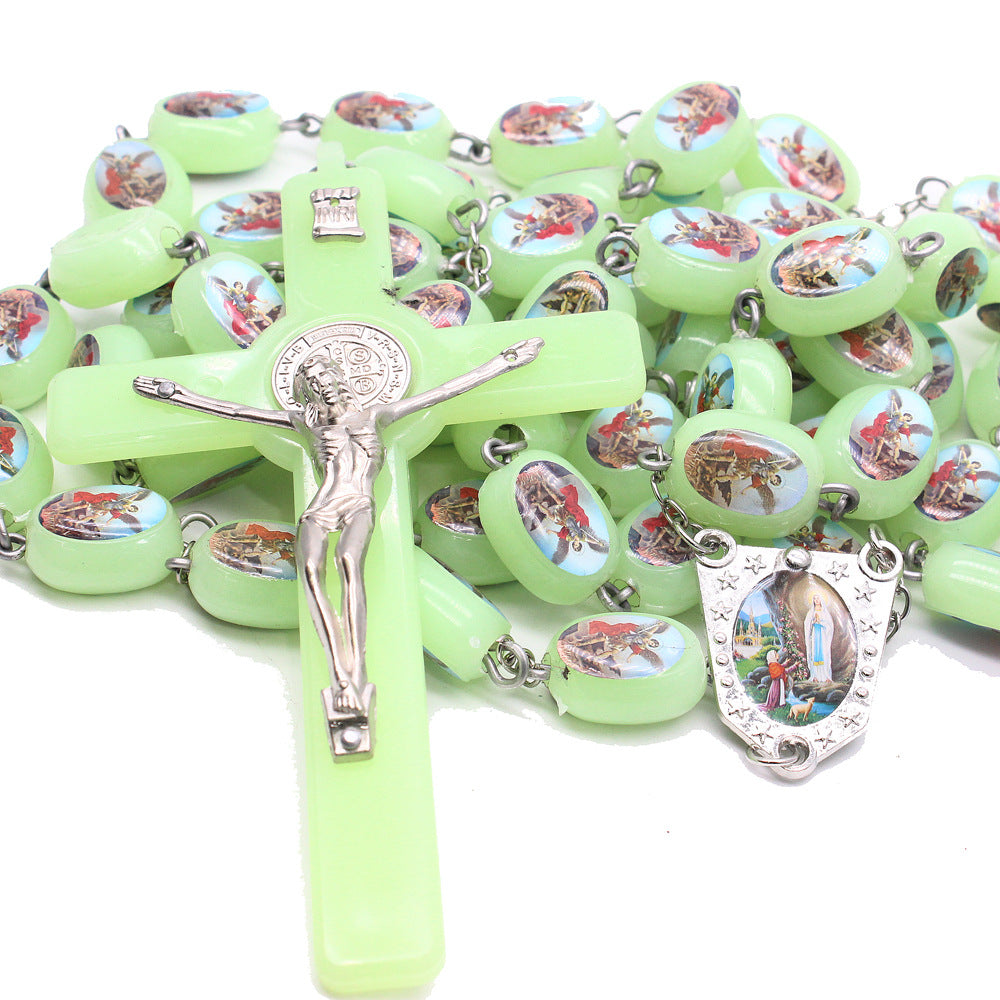 Catholic rosary beads wall display with detailed crucifix centerpiece