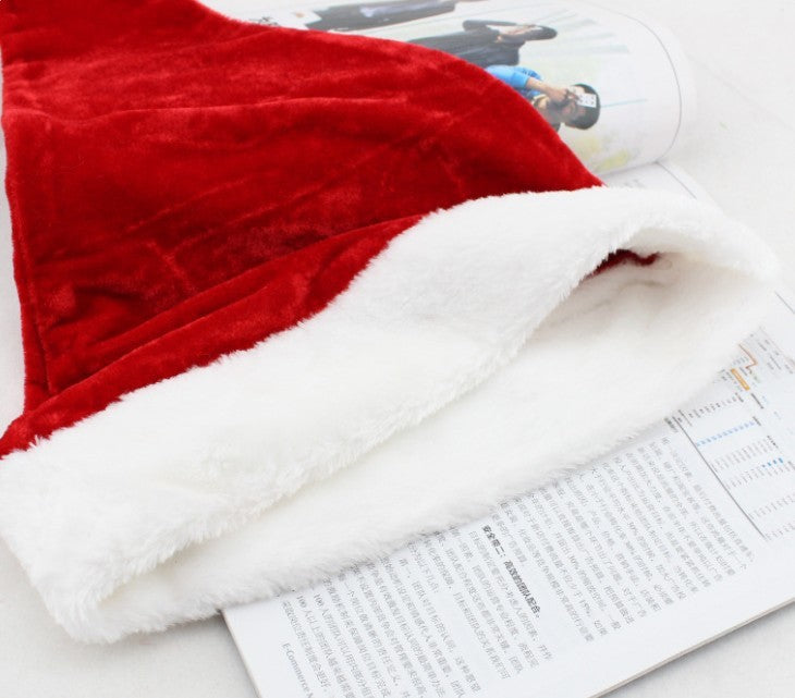 Soft velvet Santa hat with plush texture for Christmas decor