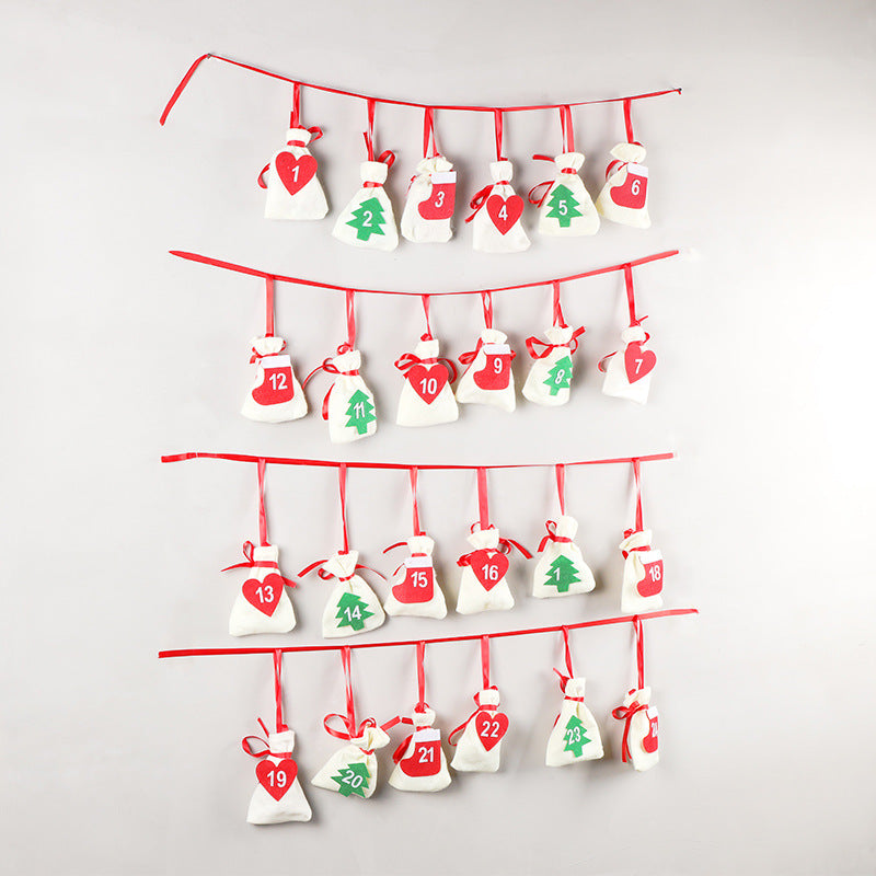 Set of three colorful felt Christmas hanging bags displayed together