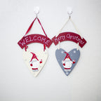 White snowman Christmas hanging ornament on wooden background, festive holiday decor