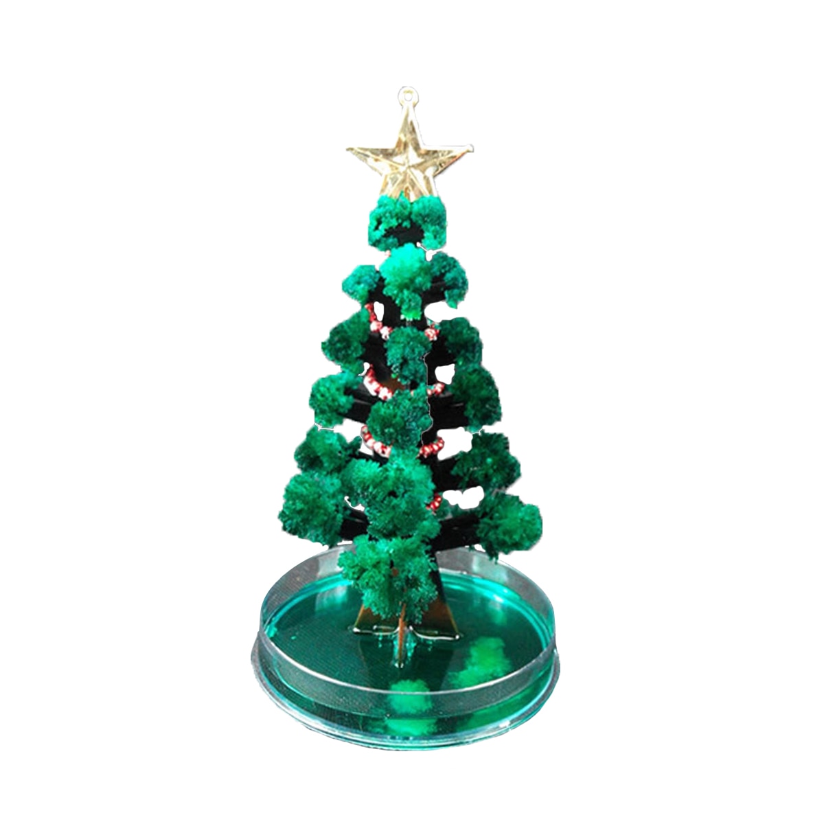 Assembled Magic Growing Paper Christmas Tree decoration on wooden surface