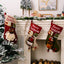 Christmas Santa stocking pendant hanging against festive backdrop