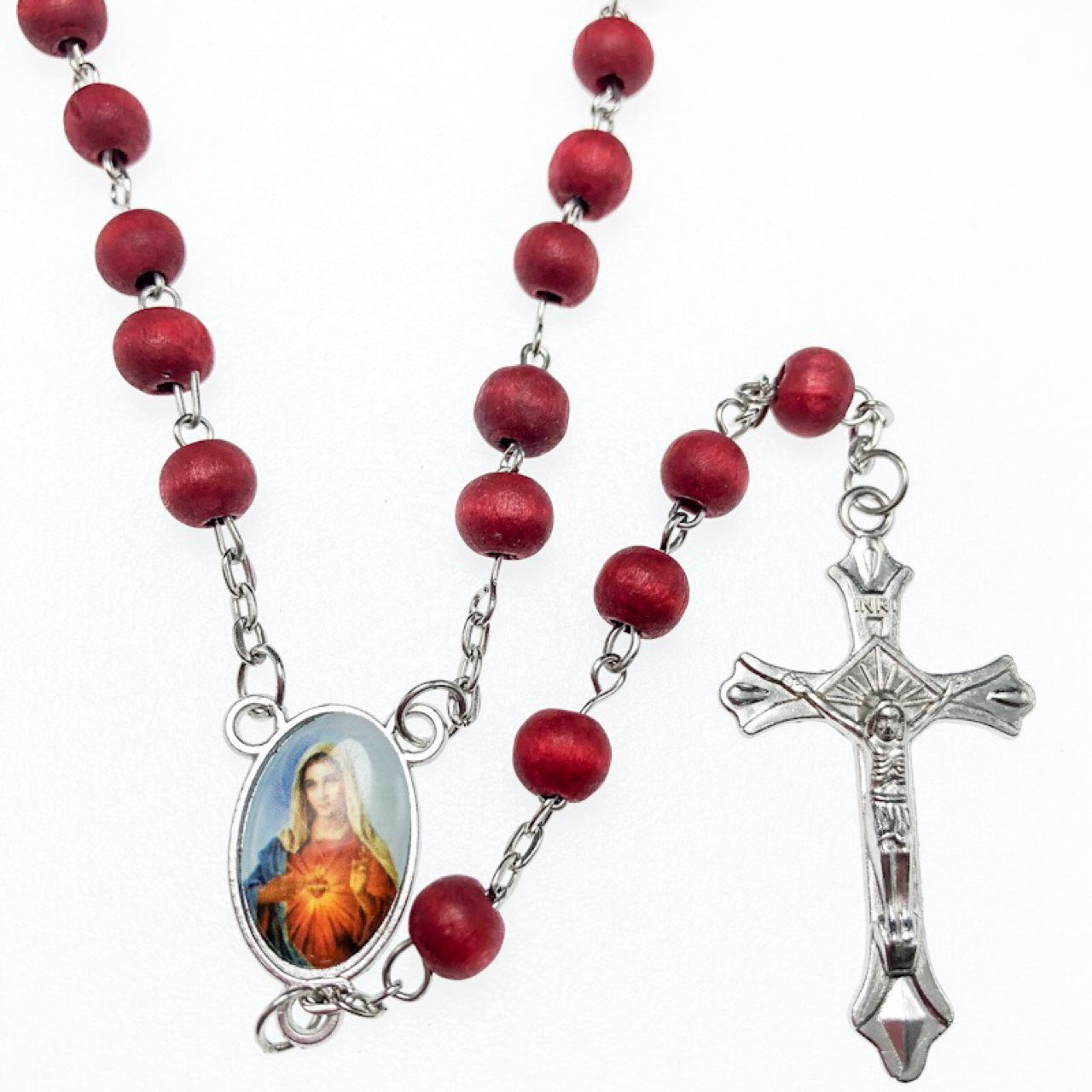 Flat lay of wooden crochet rosary on neutral background