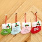 Set of four colorful Christmas stocking ornaments displayed together on a festive background