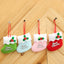 Set of four colorful Christmas stocking ornaments displayed together on a festive background