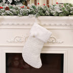 Red knitted Christmas sock ornament with classic striped pattern for holiday tree