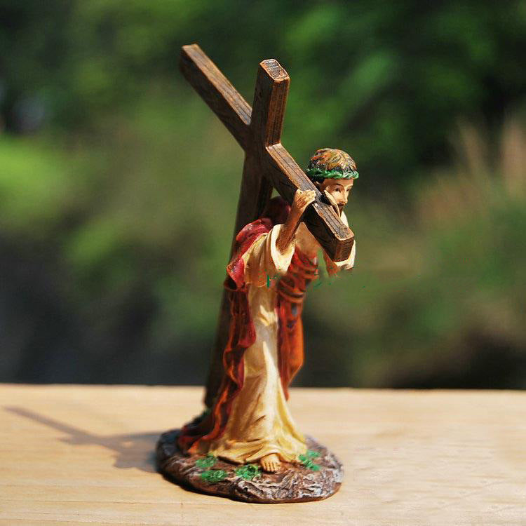 Resin crucifix ornament displayed on wooden shelf for Catholic home decor Main image