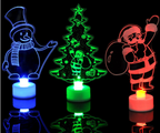 Set of three colorful glowing Christmas tree ornaments arranged together for holiday display