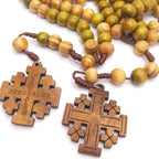 Wooden crucifix pendant with rosary beads close-up