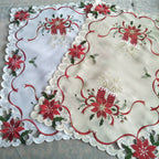 Close-up of intricate leaf and flower embroidery on festive tablecloth