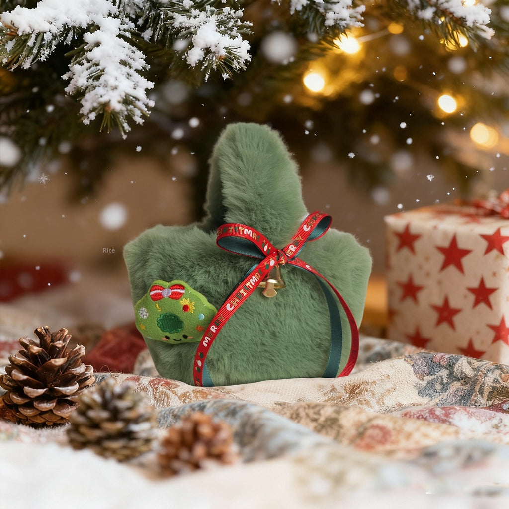 Green plush candy bag displayed with holiday decorations in background
