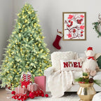 Close-up of green Christmas tree branches with soft warm white LED glow