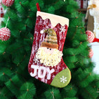 Festive Christmas gift bag with cheerful doll motif
