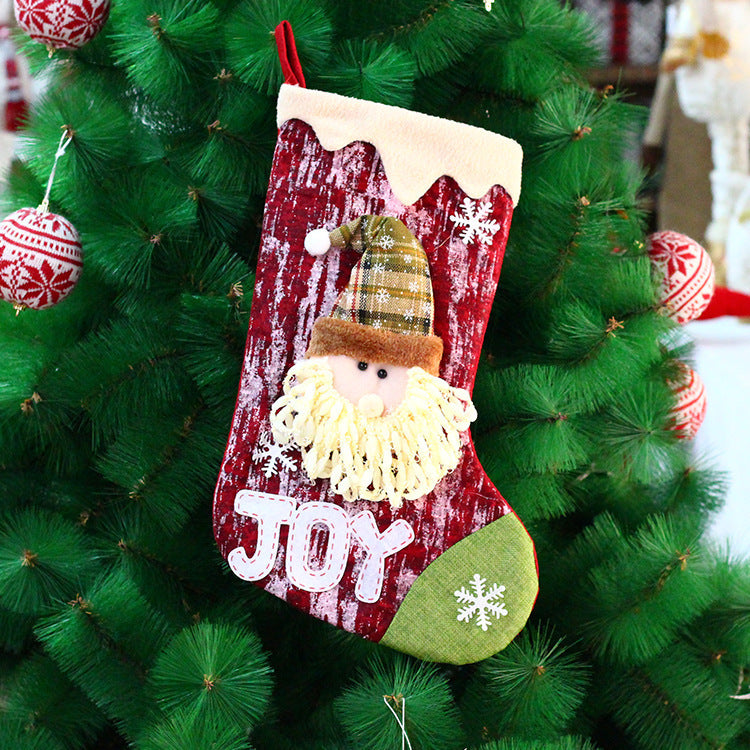 Festive Christmas gift bag with cheerful doll motif