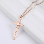 Steel colored Jesus cross pendant necklace on model