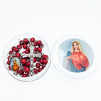Wooden rosary necklace displayed against soft fabric