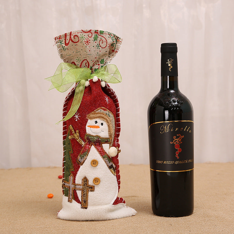 Set of fabric wine bottle covers in snowman deer and old man styles for gifting