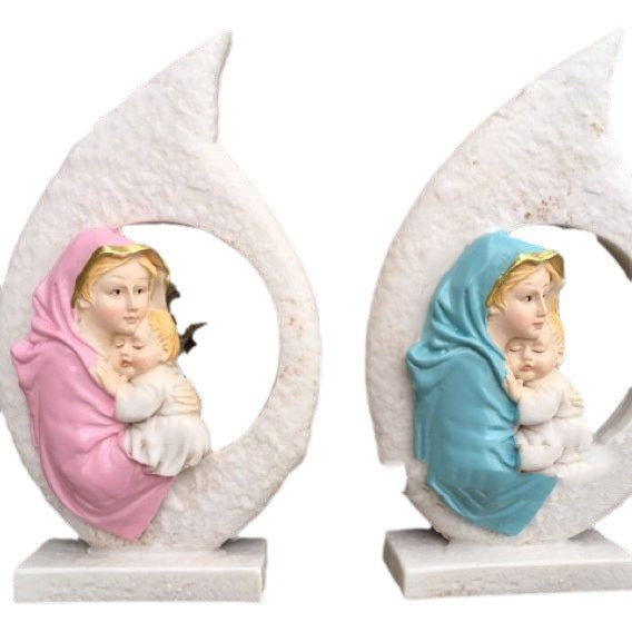 Hand painted resin ornament showing Mary tenderly holding baby Jesus in soft pink tones