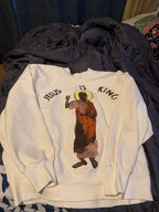Woman wearing cozy Jesus is King hoodie in everyday setting
