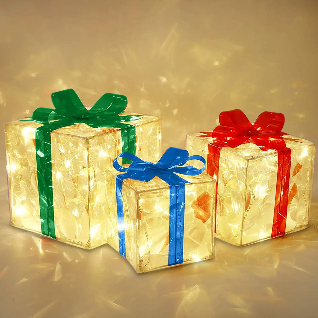 Decorative Christmas gift box with red bow and warm glowing lights