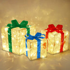 Decorative Christmas gift box with red bow and warm glowing lights
