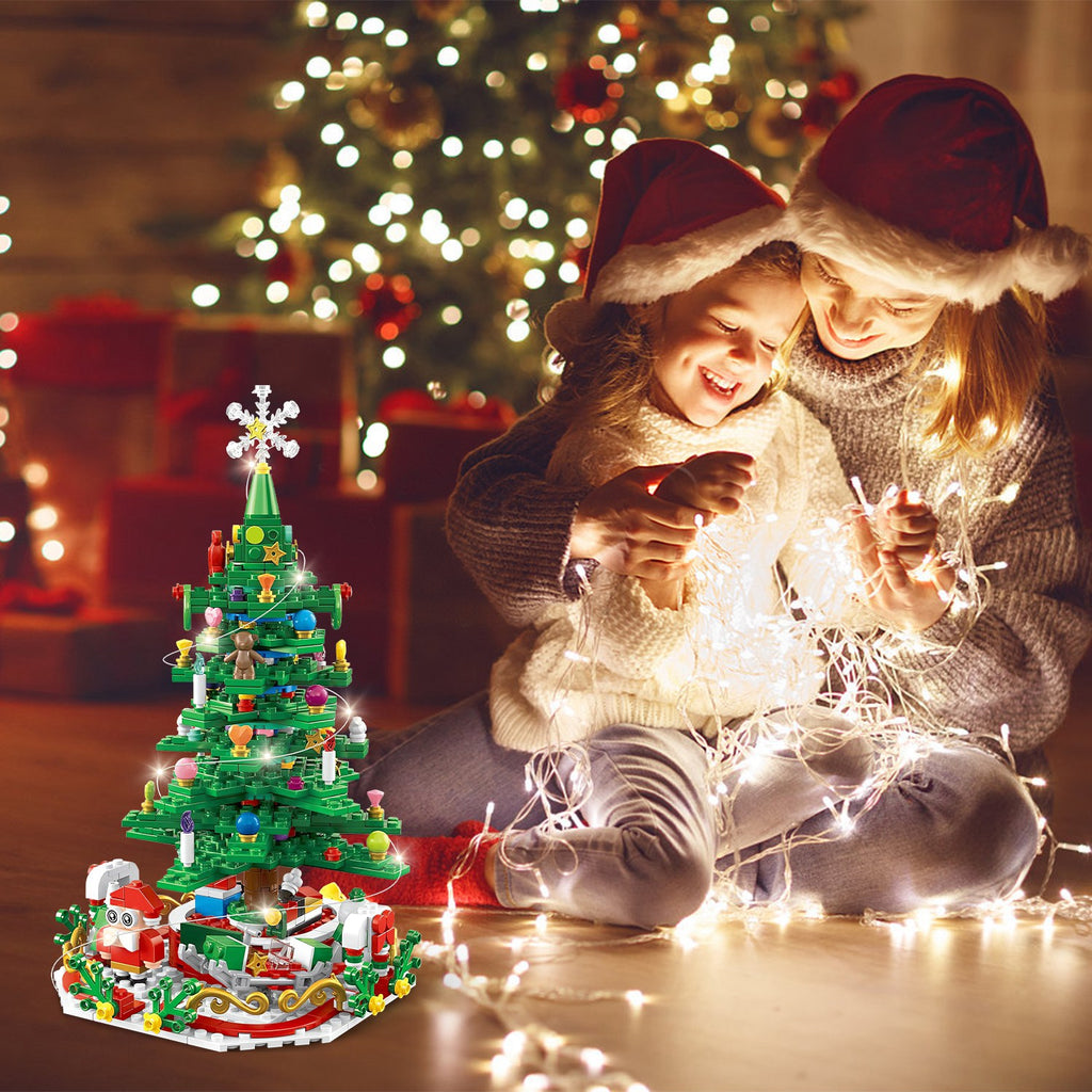 Assembled Christmas tree decoration with warm glowing LED lights on tabletop