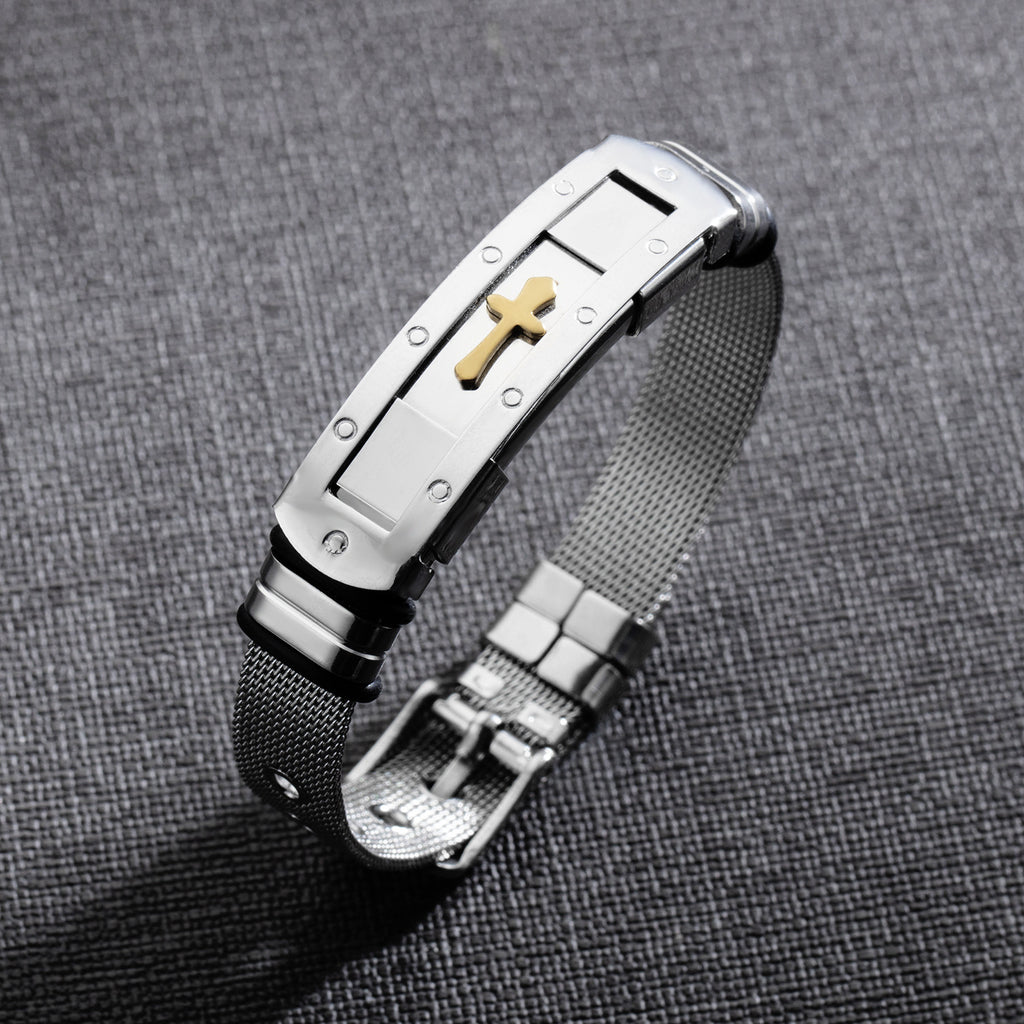 Close-up view of stainless steel cross bracelet charm