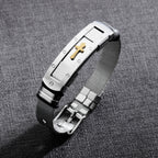 Close-up view of stainless steel cross bracelet charm