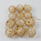 Multiple gold-tone scaly Christmas ornaments showcasing holiday ornament set quality