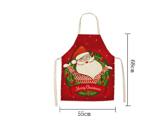 Christmas Day Apron styled in warm kitchen setting with holiday decorations visible