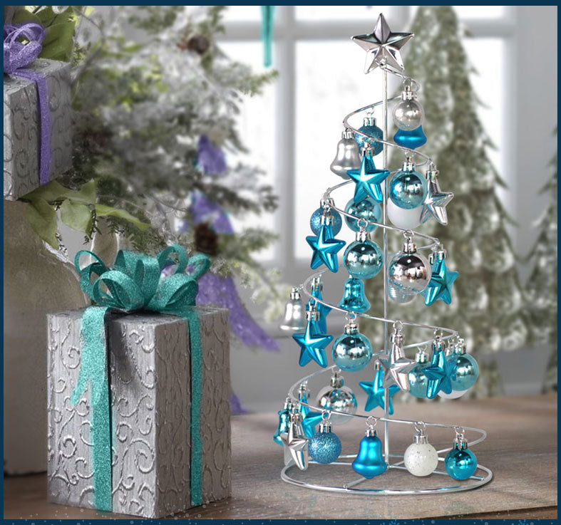 Mini Christmas tree displayed on windowsill with candlelight
