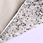 Silver white sequin Christmas tree skirt draped around holiday tree in festive living room setting