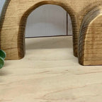 Wooden Jesus tray arranged on wooden shelf