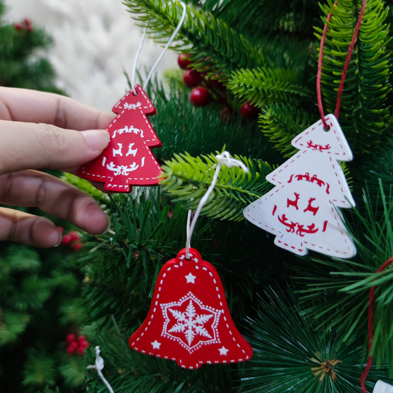 Wooden Christmas pendants arranged in decorative box ready for gifting